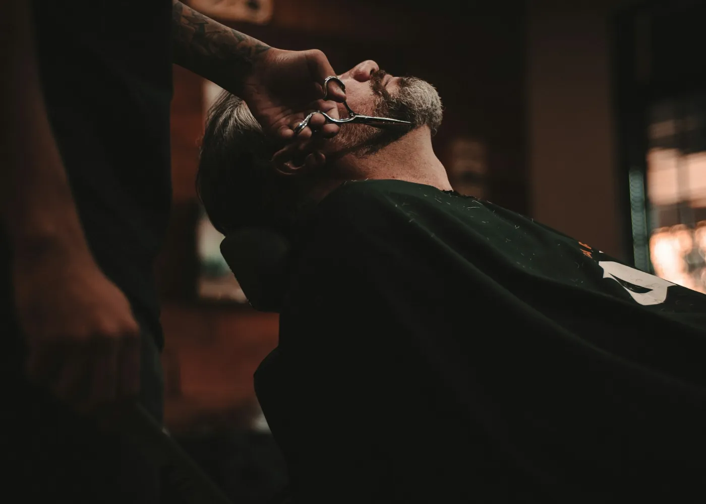 A client receiving a razor shave