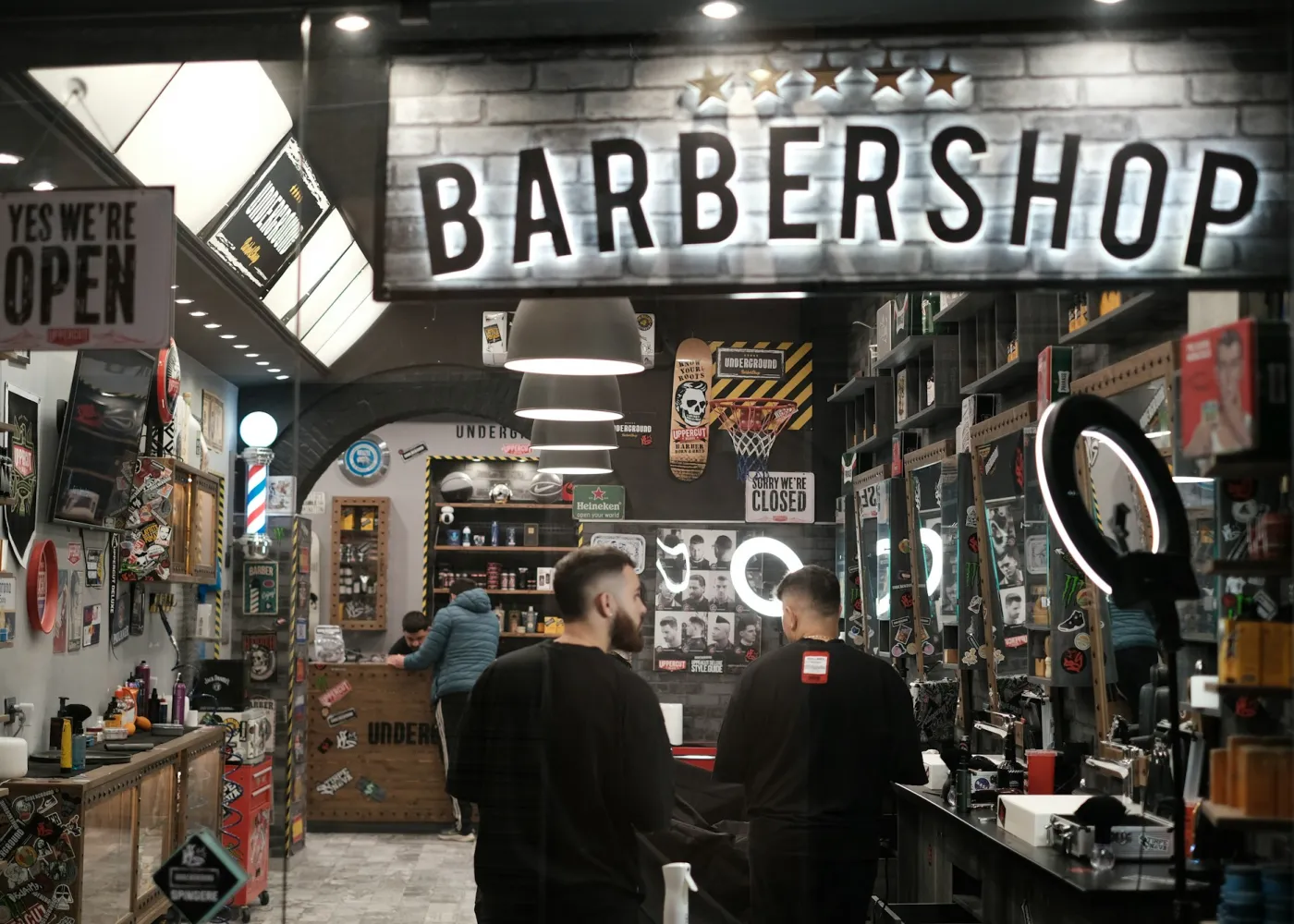 Barbers at work in a busy shop